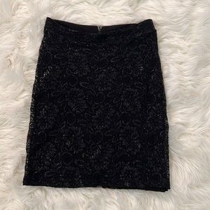 Fully lined black lace dress with accents